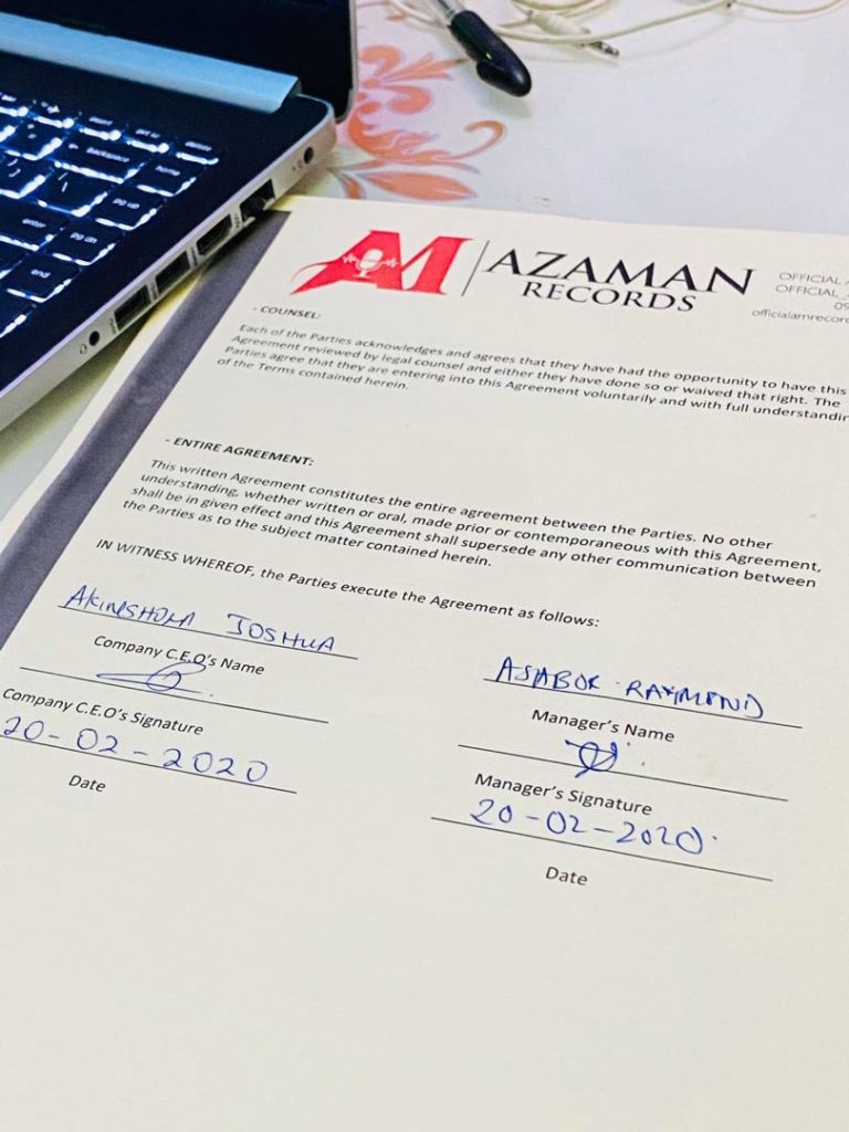 Signing Azaman Records Managing Director, Director Ray.