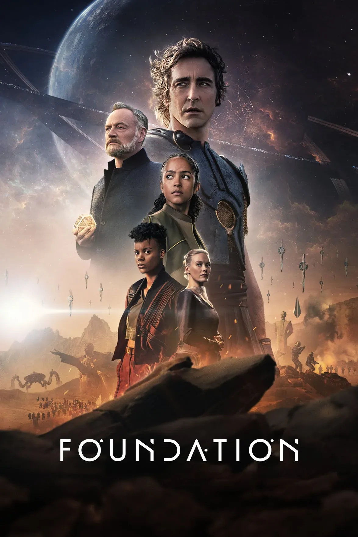In the series, Foundation Season 2 - A complex saga of humans scattered on planets throughout the galaxy all living under the rule of the Galactic Empire. Dr Hari Seldon and his loyal followers attempt to preserve their culture as the galaxy collapses around them.