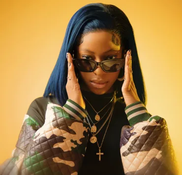 Raised by her mother and siblings, Qing Madi's early exposure to music through school talent shows and her church choir laid the foundation for her promising career.