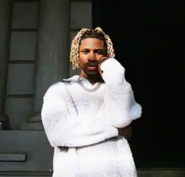 **Artist Spotlight: Khaid - A Rising Star Paving the Way in Afrobeats** In the dynamic realm of Afrobeats, Nigerian artist Khaid, born Sulaimon Shekoni Solomon on December 10, 2004, is emerging as a force to be reckoned with. Currently signed to Neville Records, Khaid's journey to stardom began with the release of "With You" after securing a record deal with Sydney Talker's label in 2022. Hailing from Shibiri-Ojo and raised in a family of ten, Khaid's early life was marked by resilience and determination. Working as a roadside mechanic to support his family and fund his music career, he transitioned from street performances to catching the attention of Sydney Talker, leading to a record deal. His breakout single, "With You," propelled him onto the Nigeria TurnTable Top 50 single chart, debuting at number 48 on February 14, 2022. Khaid's artistic journey unfolds with authenticity, as he converted to Christianity after leaving Islam, a personal evolution that adds depth to his narrative. In April 2022, Khaid dropped "SKI," accompanied by a music video directed by Sydney Talker. The release was praised for offering an honest portrayal of his life before fame. Later that year, on May 27, he unveiled his debut extended play (EP), "DIVERSITY," featuring a vibrant collage of sounds appealing to the young and young-at-heart. Khaid's creative prowess further shines in his recent EP, "Emotions," released on September 1, 2023. Lead singles "Anabella" and "Jolie" showcase his soulful melodies over Afrobeat rhythms, earning him recognition on major charts and platforms. "Jolie" peaked at number 7 on the official Nigeria TurnTable Top 100 songs, and his talent was acknowledged by industry heavyweights like Davido. The artist's impact extends globally, evident in his collaboration prospects, notably spending time with Lil Durk, hinting at potential future collaborations. His most recent single, "Marry Me," featuring viral sensation Shallipopi, adds another layer to Khaid's diverse discography. With an image rooted in spirituality and a desire to shed light on the struggles people face, Khaid's goals include shaping how the world perceives him while delivering impactful music. As Khaid's star continues to rise, his vision encompasses collaborations with industry giants like Burna Boy, Wizkid, Lil Durk, Polo G, Ed Sheeran, and Billie Eilish. In a genre dominated by trailblazers, Khaid is carving his own path, leaving an indelible mark on the ever-evolving landscape of Afrobeats. Keep an eye on this rising star as he unfolds the chapters of his musical journey.