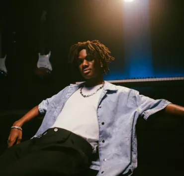 Taves In 2025 — Afrobeat, Afro-Fusion Or RNB? 9 Taves, born Aluko Toluwanimi on June 23, 2003, in Ibadan, Oyo State, Nigeria, has emerged as one of the most exciting young voices in the Nigerian music scene. With a unique ability to blend Afrobeat, R&B, and pop into a sound that feels both familiar and refreshingly innovative, Taves is redefining expectations of what it means to be an Afro-fusion artist today. His journey began humbly in the culturally rich city of Ibadan, where he was exposed to a mix of traditional and contemporary music that would later influence his artistry. From an early age, music served as both a creative outlet and a source of inspiration. Guided by the soulful melodies of Aṣa and the emotive storytelling of international acts like Khalid and Ed Sheeran, Taves began crafting his sound—a careful balance of introspection, melody, and rhythm. Taves took his first professional step in music with the release of his debut single, Betterment, in 2021. The track, which introduced listeners to his emotive vocals and thoughtful lyrics, marked the beginning of a promising career. He followed it up with 5AM Dreaming, a song that resonated deeply with fans and would later become part of his debut EP, 18. Released in 2021, the EP showcased his versatility, with tracks that explored themes of ambition, self-discovery, and youthful aspirations. His breakout moment came in 2022 when his cover of BNXN’s (formerly BUJU) For Days gained significant traction online. The viral moment not only drew attention to his talent but also solidified his relationship with BNXN, eventually leading to a record deal with To Your Ears Entertainment, BNXN's record label. Through this partnership, Taves gained access to a global audience, supported by the label’s affiliation with Atlantic Records UK. This milestone marked a turning point, providing the resources and platform to elevate his artistry to new heights. In 2023, with the backing of To Your Ears Entertainment, Taves released the highly anticipated single Eleyele, which added another layer to his growing catalog. The song was well-received by fans and critics alike, further solidifying his position in the Nigerian music scene. 2024 saw Taves expanding his repertoire even further. He released a two-track capsule featuring Bodija and Folake, followed by A Million Things and In The City, each song showcasing his dynamic vocal delivery and ability to experiment with different genres and styles. This was just a precursor to his sophomore release, the 8-track EP Are You Listening?, which dropped later in 2024. The EP demonstrated his continued growth as an artist, with standout tracks like Bad Romance reflecting his depth as a storyteller and his evolving sound. Taves' contributions extended beyond his own music as he also featured on BNXN’s debut album Sincerely BNXN. His contribution added a fresh dimension to the project, highlighting his ability to complement BNXN’s sound while maintaining his unique identity. This collaboration played a key role in further solidifying Taves as an artist to watch in the Nigerian and international music scenes. Throughout his career, Taves has also been featured on notable tracks with other prominent Nigerian artists, including LAX and Ladipoe. These collaborations further expanded his visibility and solidified his place in the African music landscape. As of December 2024, Taves continues to ride high on the success of his recent release, Adanna, and his sophomore EP. His unique ability to blend Afrobeat, R&B, and pop with emotionally charged lyrics has earned him a dedicated fanbase and the respect of industry peers. Taves’ story is one of passion, perseverance, and a relentless pursuit of excellence. His ability to blend genres, connect emotionally with his audience, and remain authentic sets him apart in an industry often defined by trends.