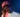 a man with braces wearing a beanie and a necklace Mikon Asuquo